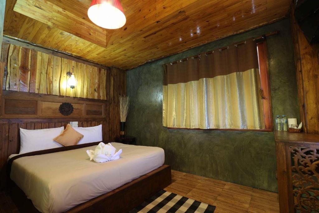 Postel nebo postele na pokoji v ubytování Sea Rock Resort