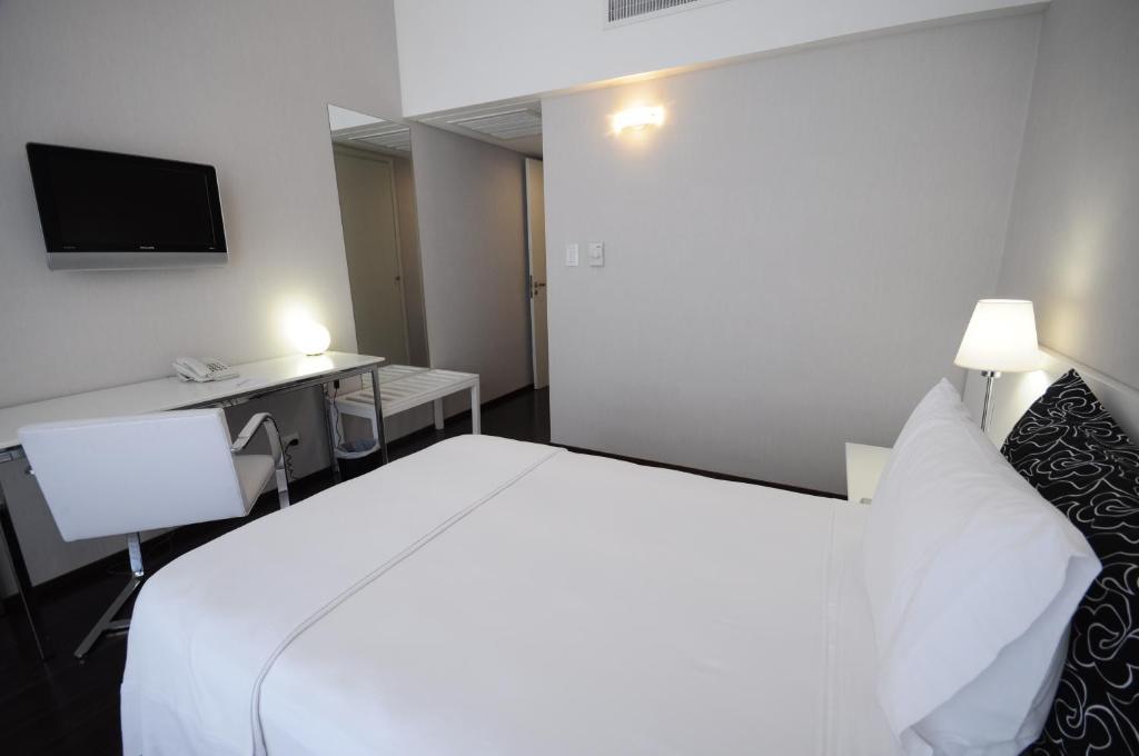 Postel nebo postele na pokoji v ubytování Hotel Guarani Asuncion