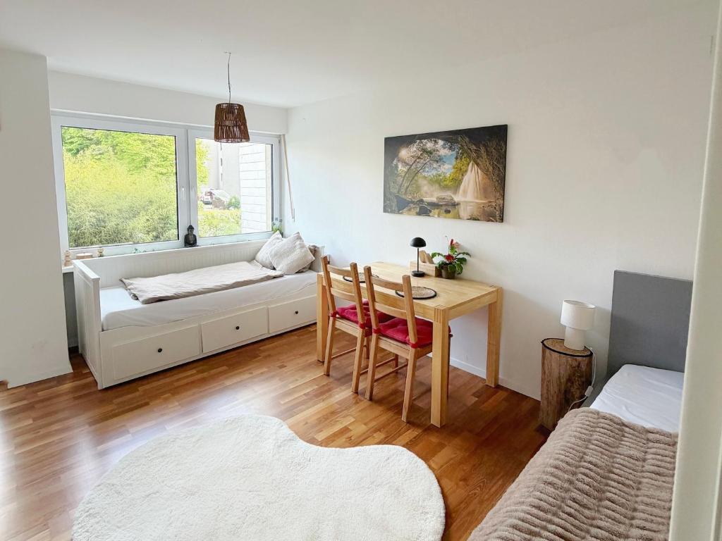 a living room with a table and a couch at Horizon Apartments in Memmingen