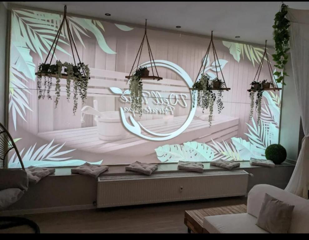 a room with a wall with plants on it at Luxus Spa Wellness Apartment in Heiligenhaus