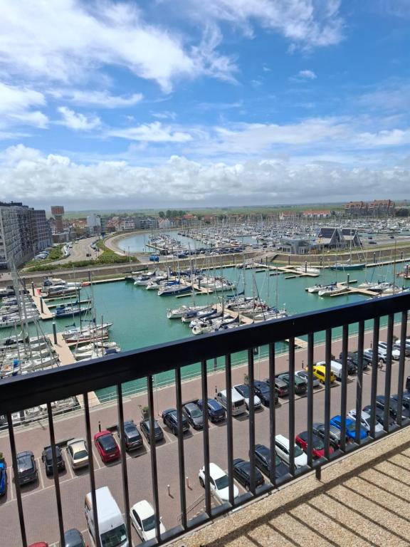 a view of a marina with boats in the water at Appartement Havenzicht Harbor View in Blankenberge
