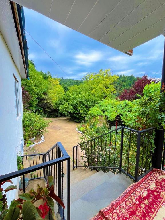 a balcony of a house with a view at Sweet home in Lerik