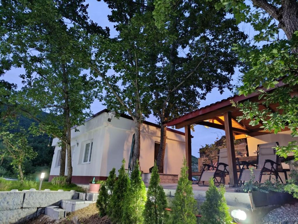 an exterior view of a house with a pavilion at Apartman Ramljak in Prozor