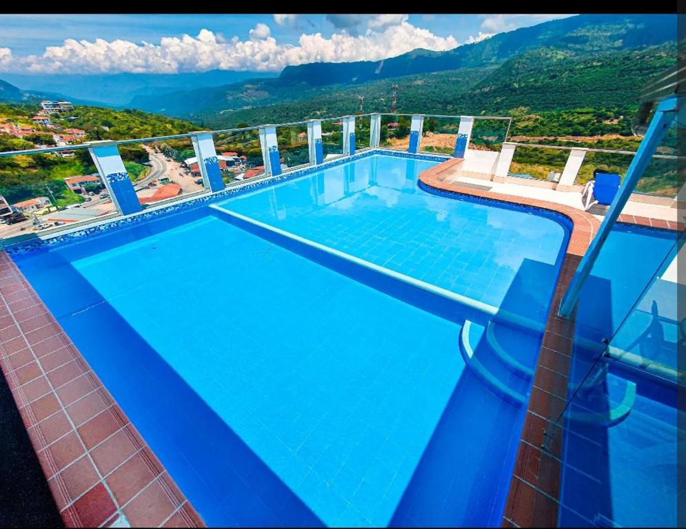 a large swimming pool on top of a building at Apartamento san gil plaza in San Gil