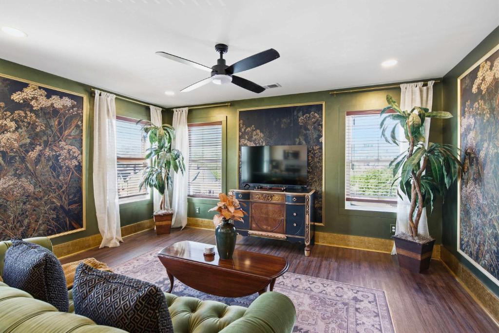 a living room with a couch and a tv at The Bavarian Inn 6 Chic 1 BDR in Covington