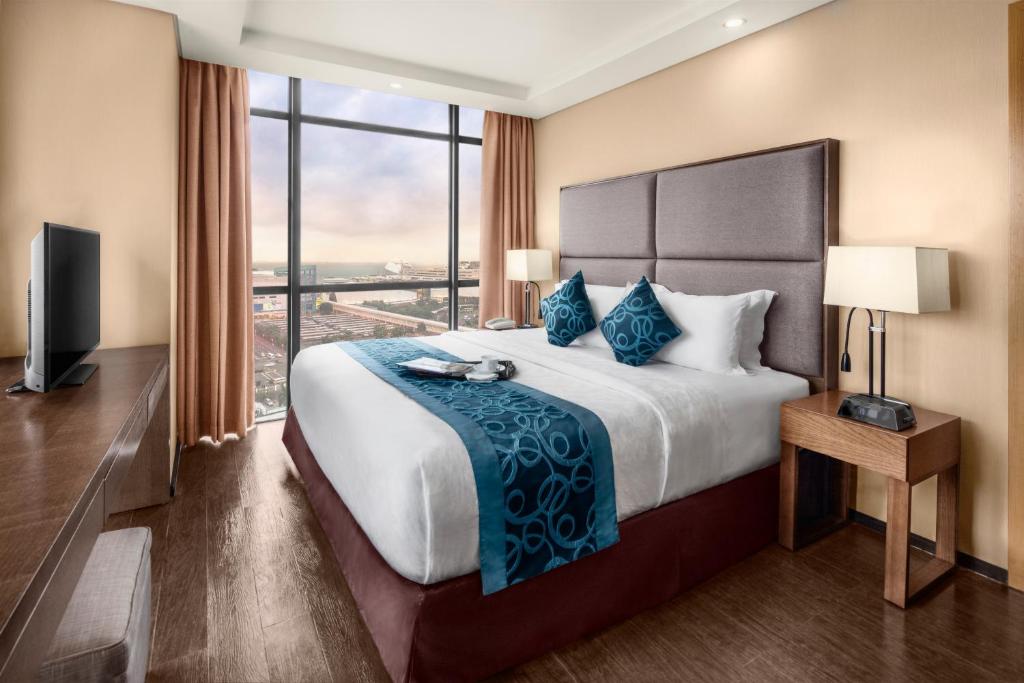 Postel nebo postele na pokoji v ubytování Golden Phoenix Hotel - Manila