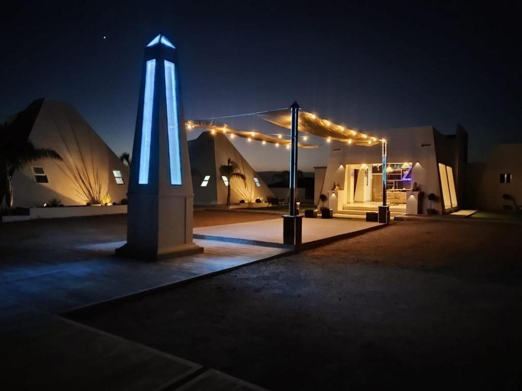 a lit up tent at night with lights at Villas Safir en Valle de Gpe in Los Hornos