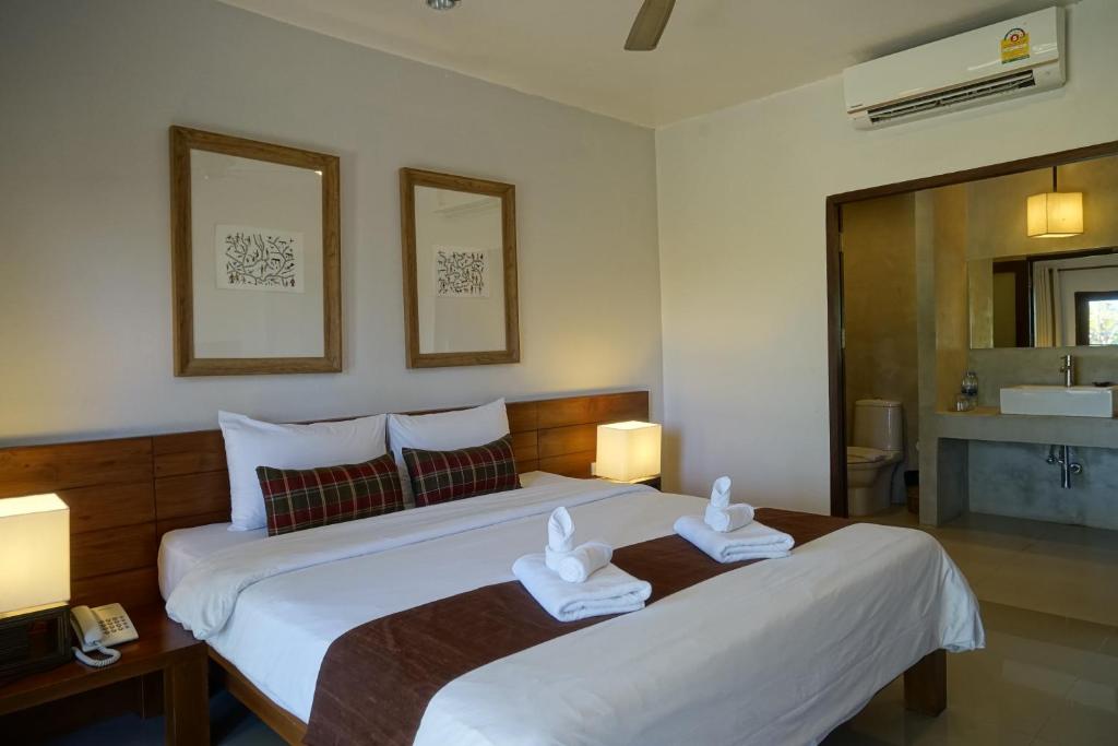 Postel nebo postele na pokoji v ubytování Yoma Hotel, Pai