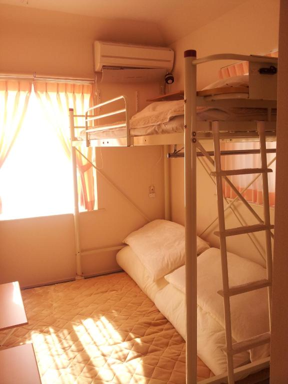 Postel nebo postele na pokoji v ubytování Tokyo8home Hachioji 東京民宿 八王子之家
