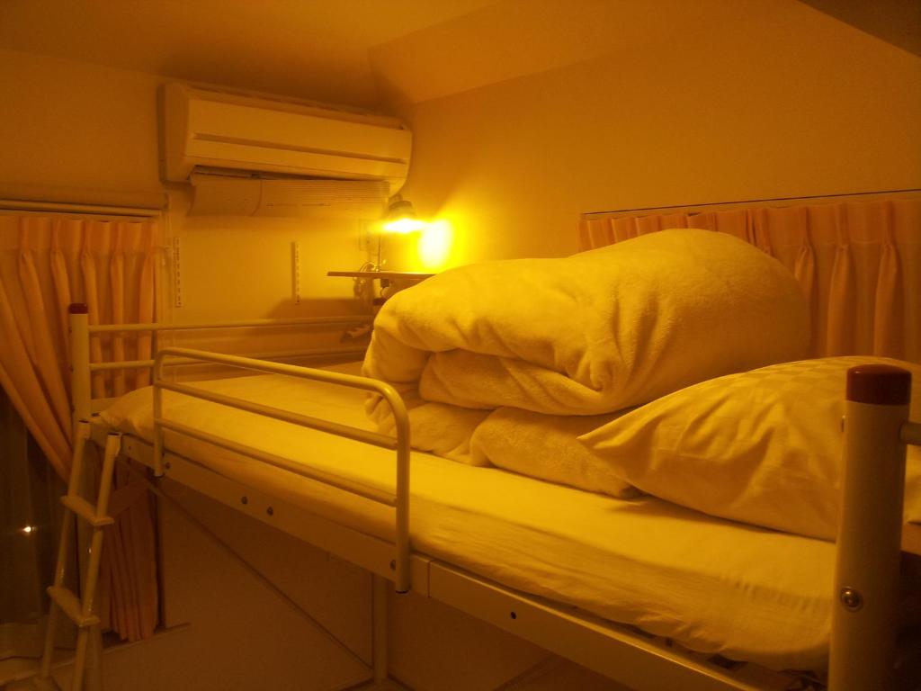 Postel nebo postele na pokoji v ubytování Tokyo8home Hachioji 東京民宿 八王子之家