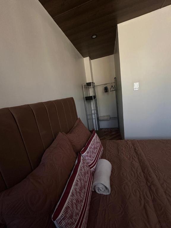 a brown couch in a living room with at Wiracocha Apartments #4 in Pisac