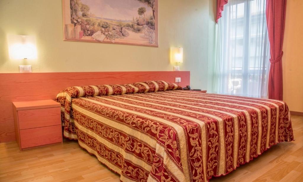 Postel nebo postele na pokoji v ubytování Hotel Benaco