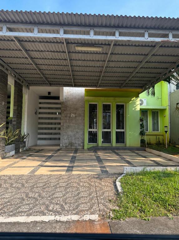 a building with a pergola on top of it at Arcovella House in Cikarang