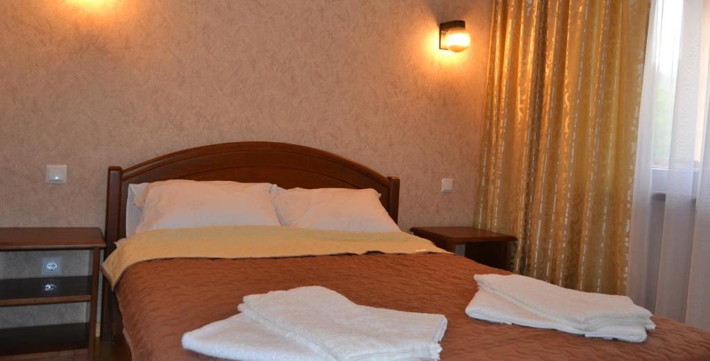 Postel nebo postele na pokoji v ubytování Bilovoddya Hotel