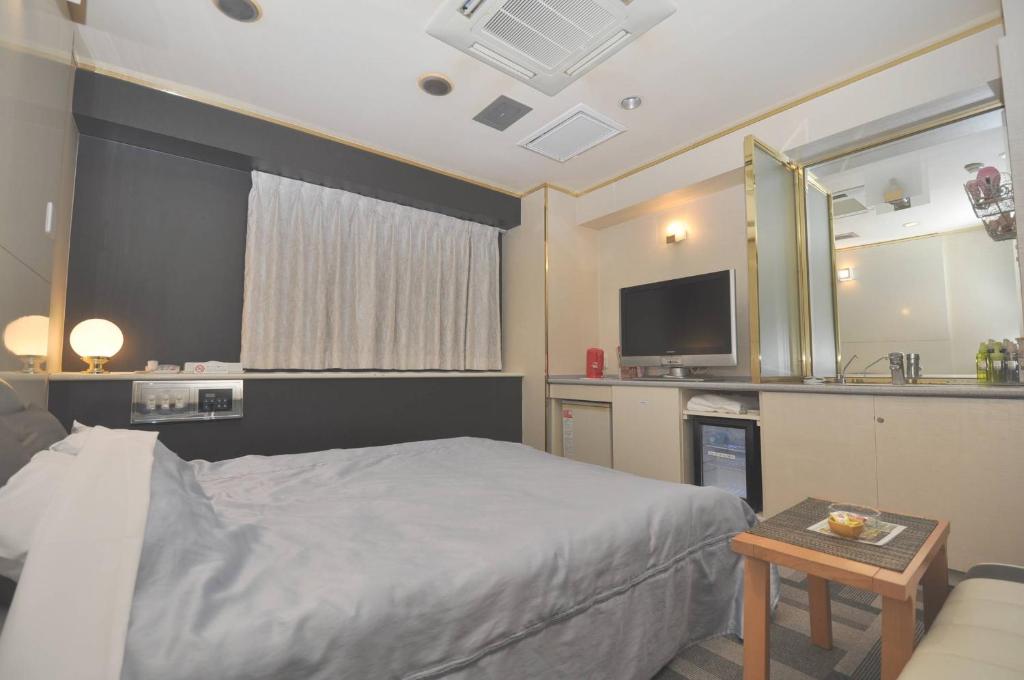 Postel nebo postele na pokoji v ubytování Hotel Boston Club (Adult Only)