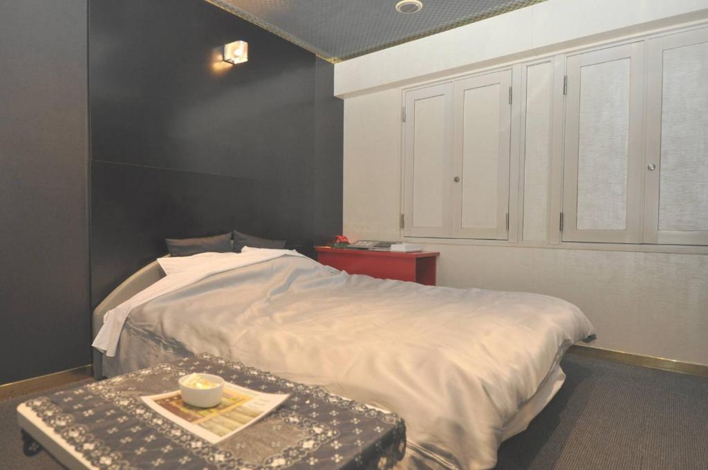 Postel nebo postele na pokoji v ubytování Hotel Boston Club (Adult Only)