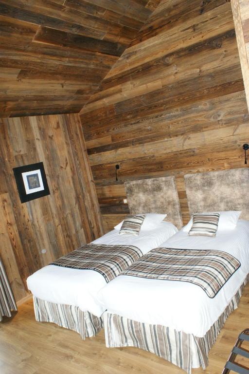 Postel nebo postele na pokoji v ubytování Hotel Blanc