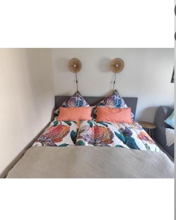 a bed with two pillows on top of it at Little Castle in Bad Kreuznach