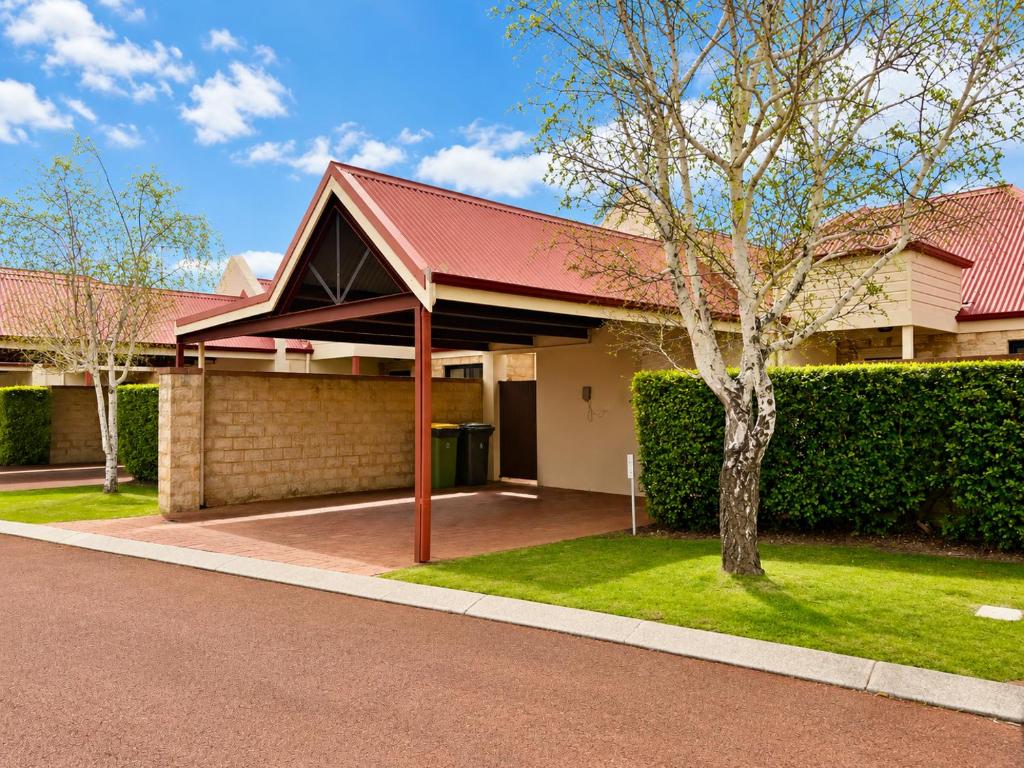 a house with a red roof and a tree at Longer Days at Halcyon Daze in Dunsborough