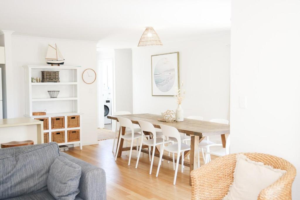 a living room with a dining room table and chairs at 'The Perch' - Central location in Robe, park your car and walk to everything in Robe