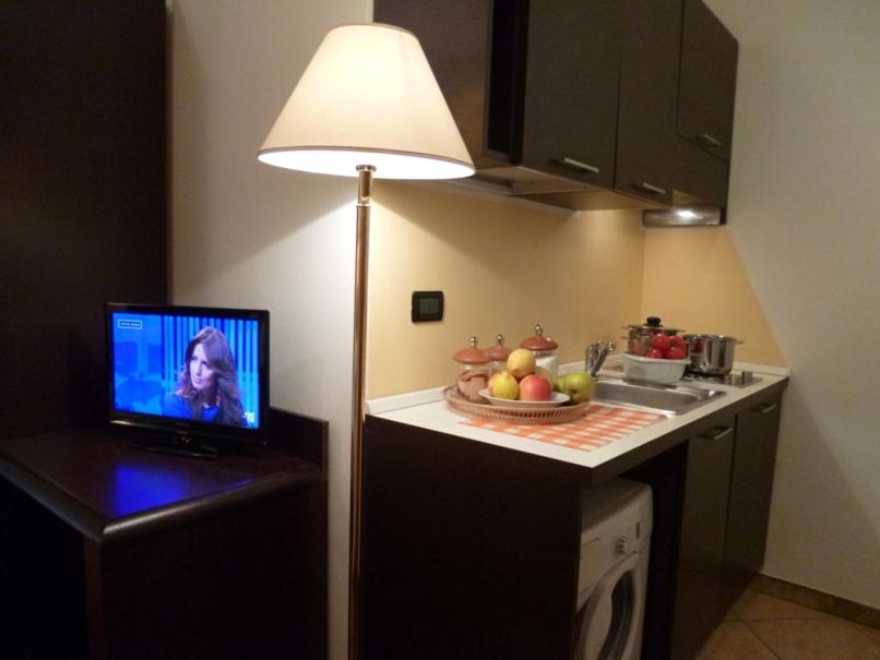 Kuchyň nebo kuchyňský kout v ubytování Air Hotel
