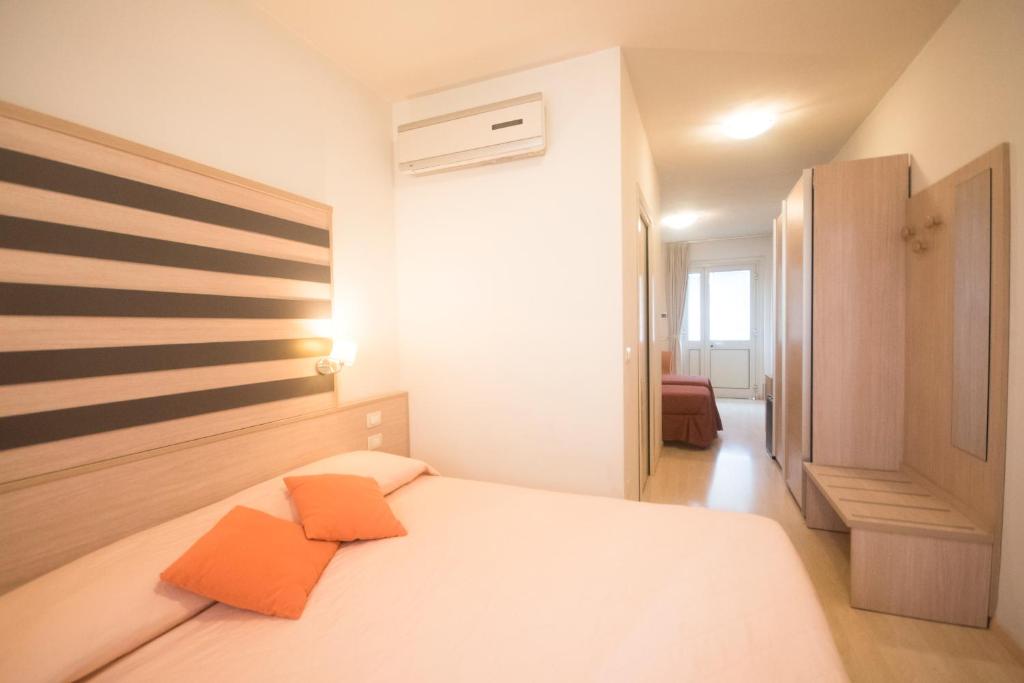 Postel nebo postele na pokoji v ubytování Stilhotel