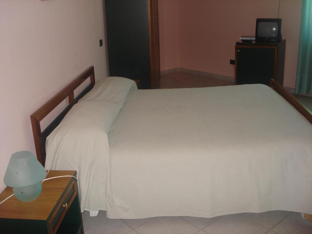 Posteľ alebo postele v izbe v ubytovaní Hotel Grandinetti