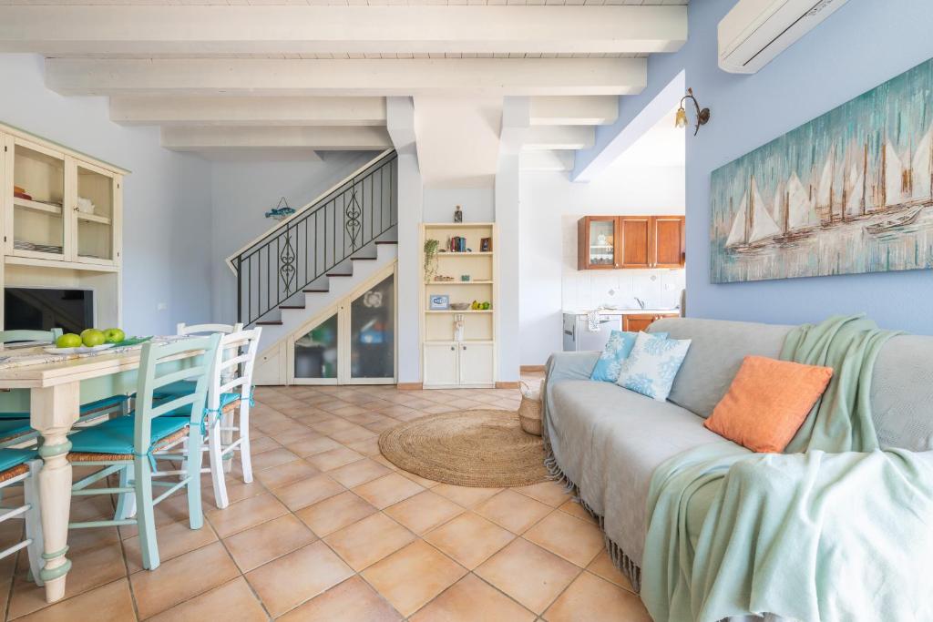 a living room with a couch and a table at Alloggio Poseidone in Villasimius