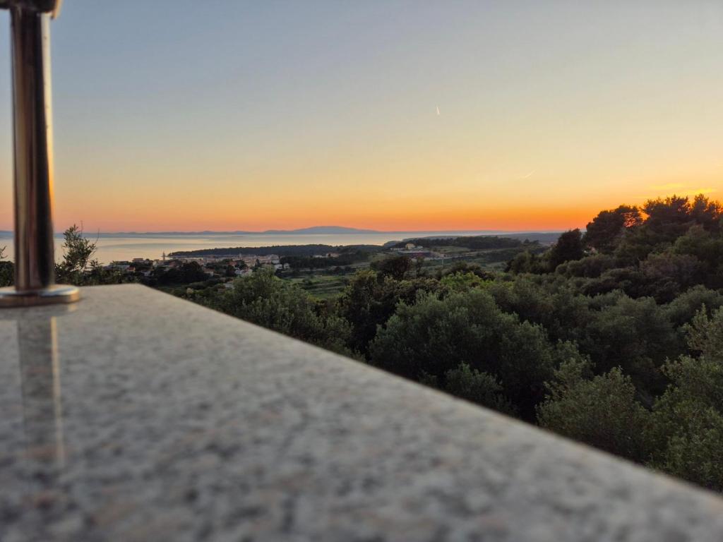 a sunset from the balcony of a house at Ribarićevi dvori in Banjol