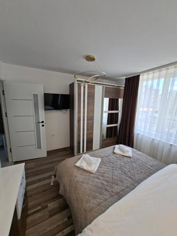 a bedroom with a bed with two pillows on it at Studio Niki in Smolyan