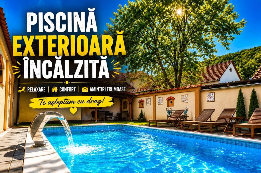 a magazine cover for a resort with a swimming pool at Carolina House in Sighişoara