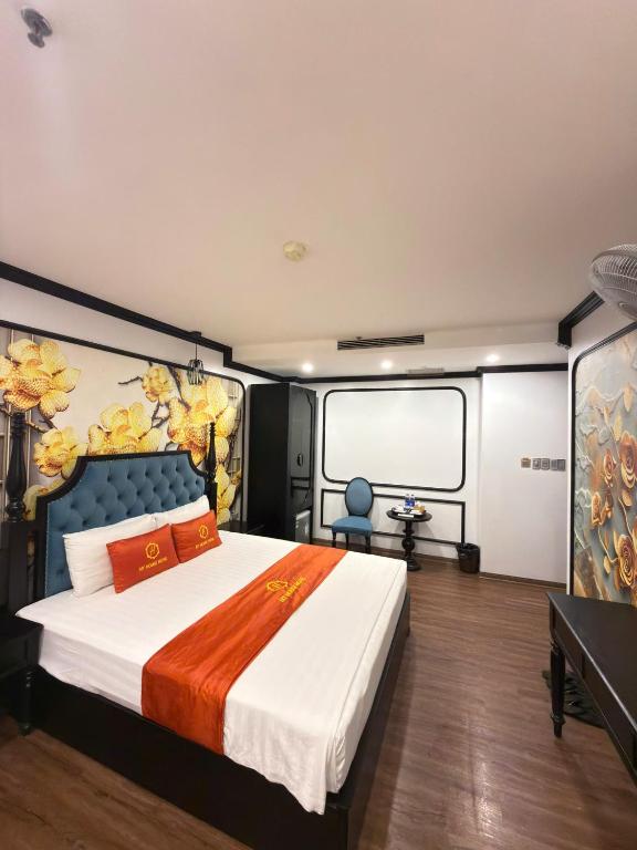 a bedroom with a large bed in a room at My House Hotel Hanoi in Hanoi