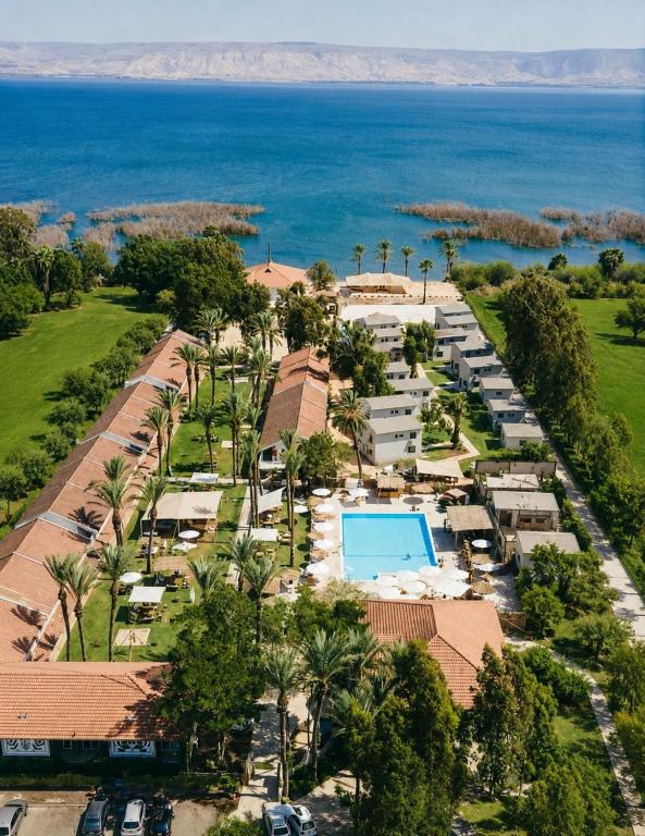 an aerial view of a resort with a swimming pool at Solaya Kineret in Migdal