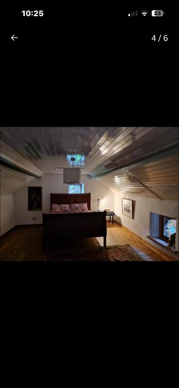 a room with a bed and a couch in a room at The Last Post in Wexford
