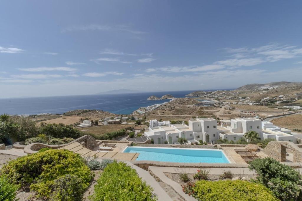 an aerial view of a villa with a swimming pool at Cycladic Boungainvillea Home in Kalafatis