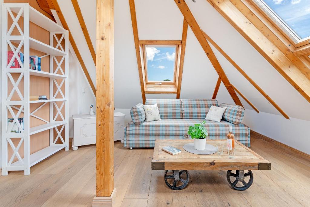 a living room with a couch and a table at Möwennest in Vitzdorf