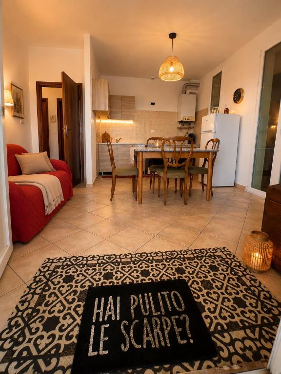 a living room with a table and a dining room at Mordano Apartment - ampio appartamento SELF CHECK-IN vicino a Imola in Mordano