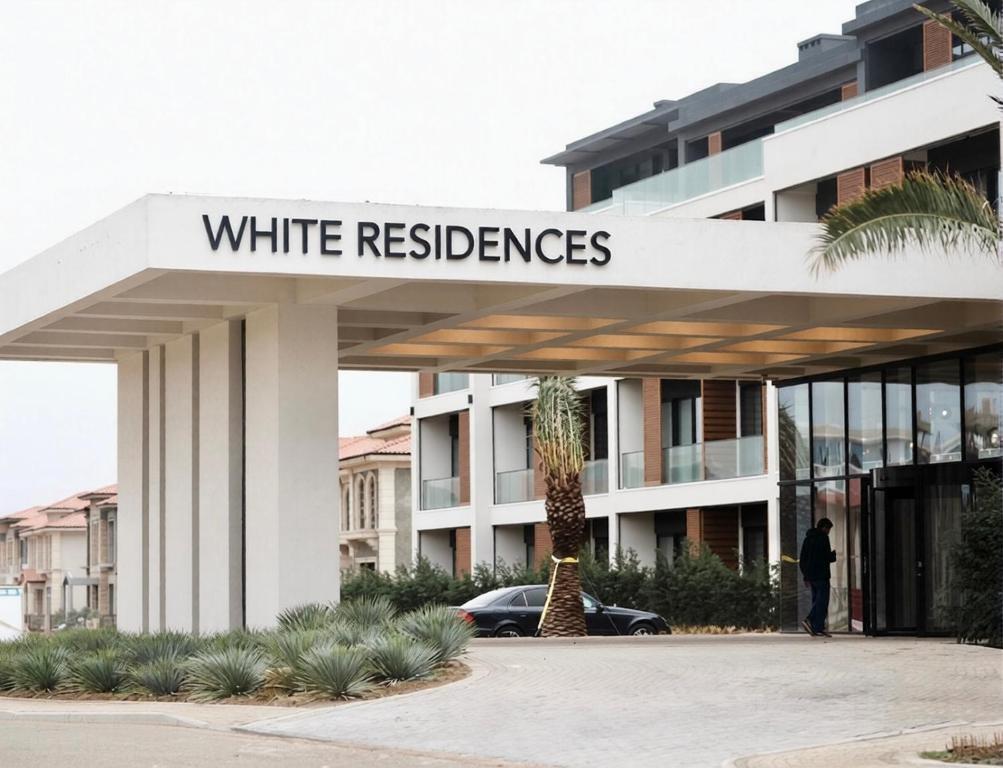 a white building with a sign that reads white reserves at Seabreeze Baku White Residence Studio, Terrace in Baku