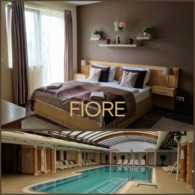 a hotel room with a bed and a swimming pool at Fiore Wellness Apartman in Zalakaros