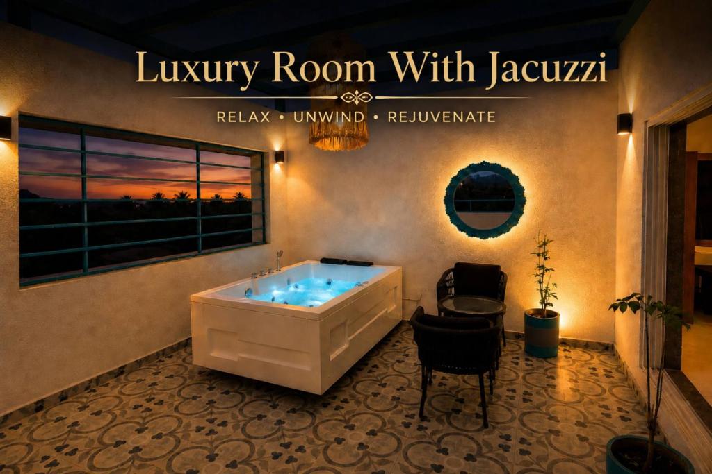 a bath tub in a room with a window at High Five Hotels Phase 2 in Assagao