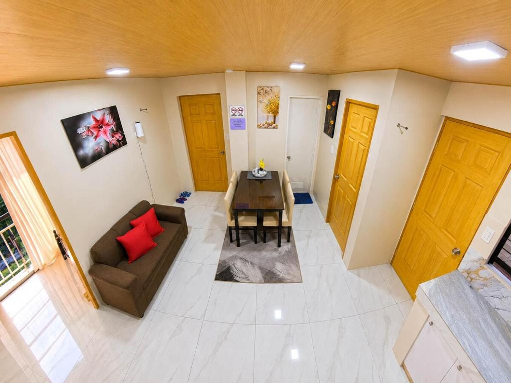 an overhead view of a living room with a table and a couch at CLBC Residences - 2B in Ibaba