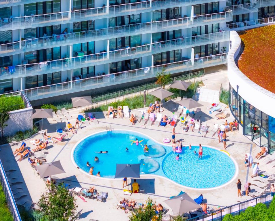 an aerial view of an apartment complex with a pool at Happy Land Aqua Polanki B405 in Kołobrzeg