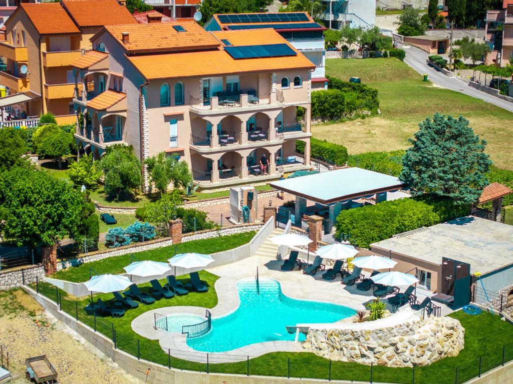 an aerial view of a resort with a swimming pool at Lopar Family Residence 543a in Lopar