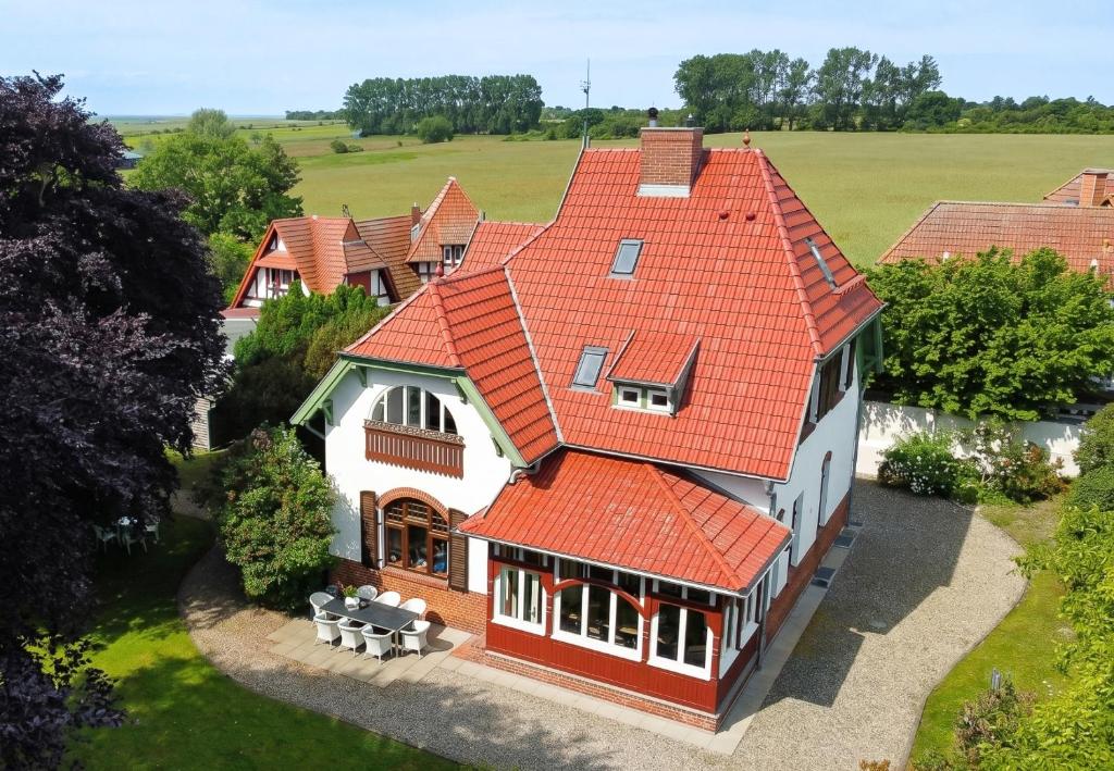 an aerial view of a house with an orange roof at Villa Boddenwacht in Ahrenshoop