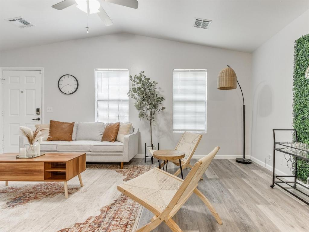a living room with a couch and a table at Oak & Elm 2BR King & Queen Edmond, OK in Edmond