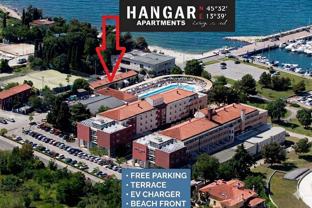 an aerial view of a building with a pool at Hangar Apartments in Izola