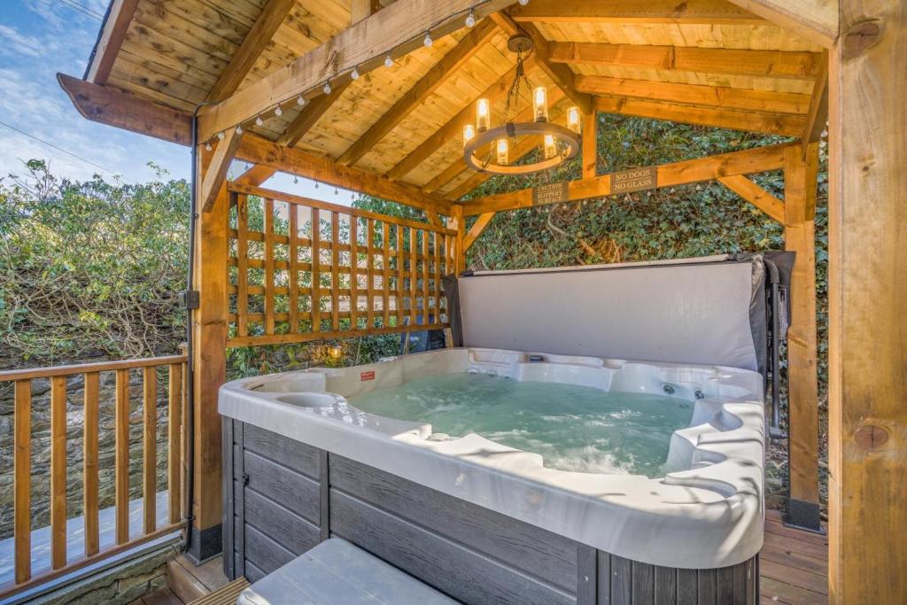 a jacuzzi tub in a wooden house at 1 Bed in Banff oc-t42474 in Banff