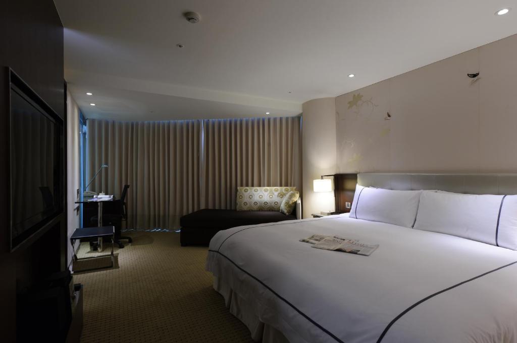 Postel nebo postele na pokoji v ubytování K Hotel Taipei Dunnan