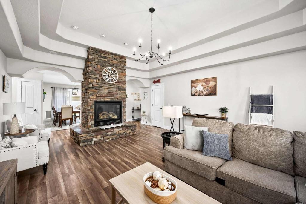 a living room with a couch and a fireplace at Prairie Falls in Post Falls