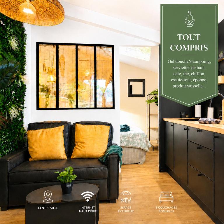 a living room with a couch and a window at L'Évasion Tropicale, Queen Size, Jardin & Gare in Saint-Brieuc